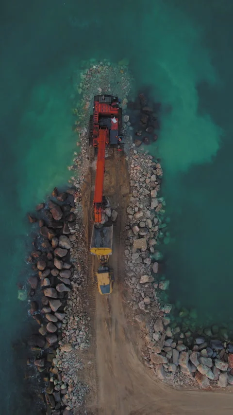 Vertical marine engineering documentation of excavator building breakwater Stock Footage 312150208