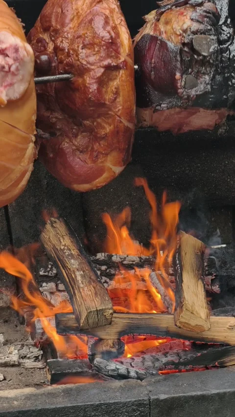 Vertical Meat Roasting Over Open Wood Fire Rustic BBQ Cooking 4K Stock Footage 332162899