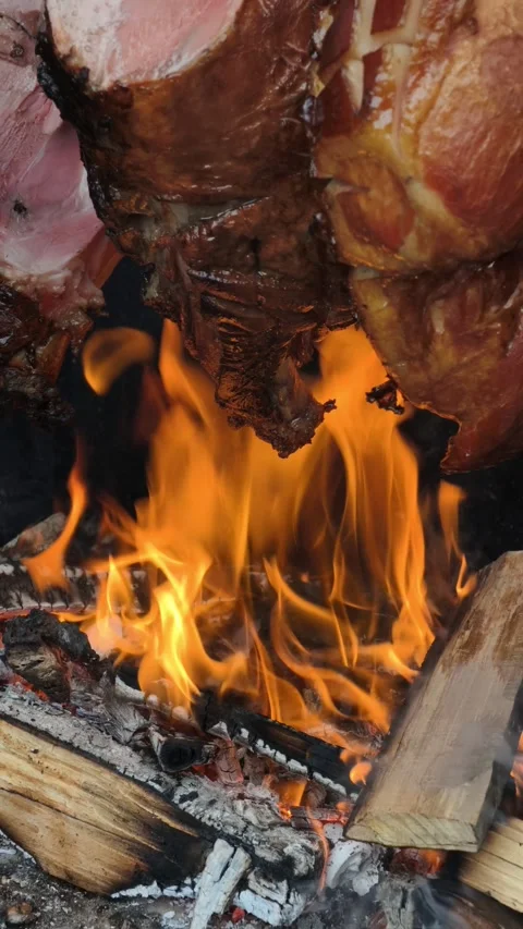 Vertical Meat Roasting Over Open Wood Fire Rustic BBQ Cooking 4K Stock-Footage 332162978