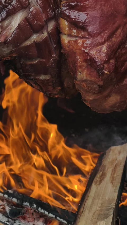 Vertical Meat Roasting Over Open Wood Fire Rustic BBQ Cooking 4K Stock-Footage 332163028