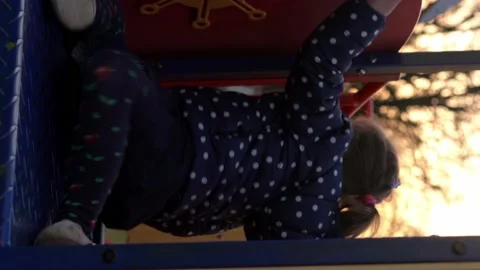 Vertical Medium plan Portrait of one cute little Siblng girl having fun playing Stock Footage 172755466