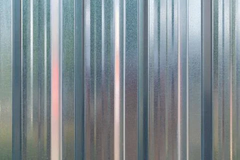 Vertical metal corrugated surface. Backgrounds and textures. Stock Photos