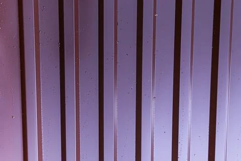 Vertical metallic profile pattern lilac red galvanized surface covered with d Stock Photos