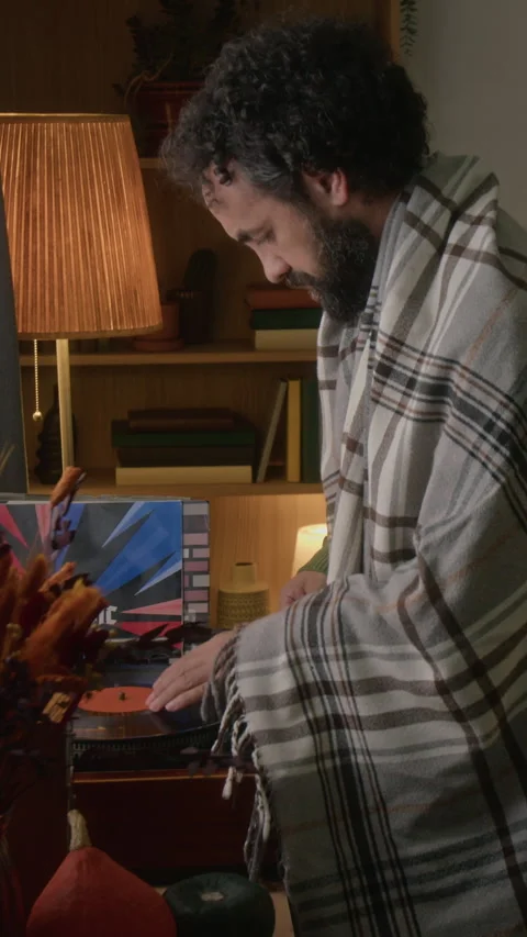 Vertical of Middle Aged Man Putting Vinyl Record on Turntable at Home Vidéo 341678200