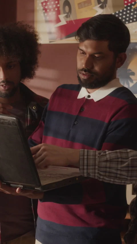 Vertical of Middle-Eastern Programmers Team Discussing Software Startup Stock Footage 276414732