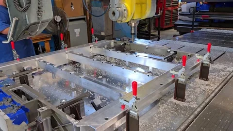 Vertical milling machine machining aluminum frame for vehicle battery tray Video stock 332621829