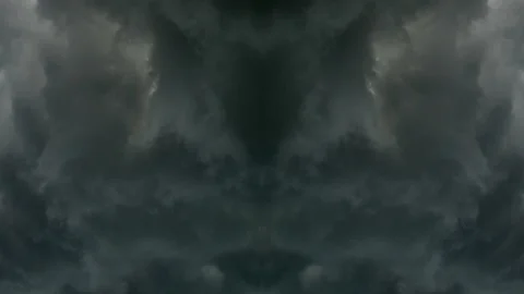 Vertical mirror image of heavy rain clouds forming inwards Stock Footage 92714568