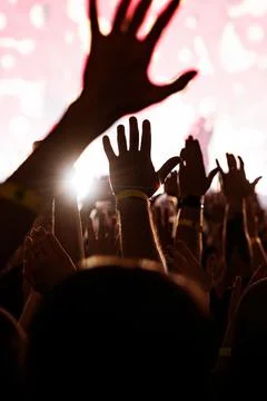 Vertical mobile background of raised hands at music festival Stock Photos
