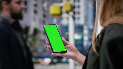 Vertical mockup screen on mobile phone held by a gen z young girl with backpack Stock Footage 326703092