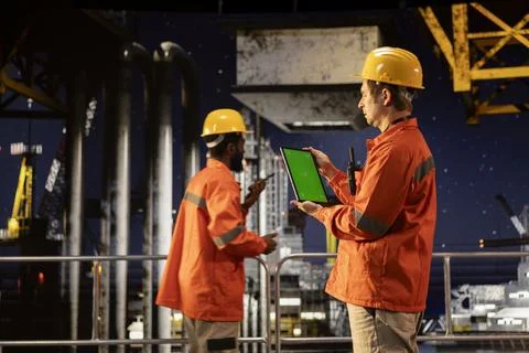 Vertical mockup screen with professional engineer inspects offshore oil rig Stock Photos