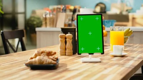 Vertical mockup screen on tablet in empty rustic kitchen with natural light Stock Photos