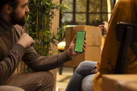 Vertical mockup on smartphone with couple thinking about layout Stock Photos
