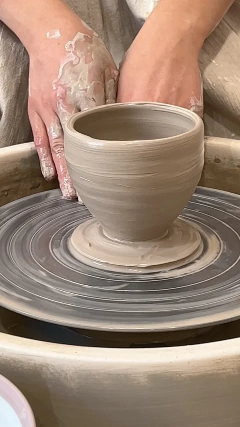 Vertical: Modeling pottery with clay on pottery wheel. Closeup cercamic workshop Stock Footage 280779674