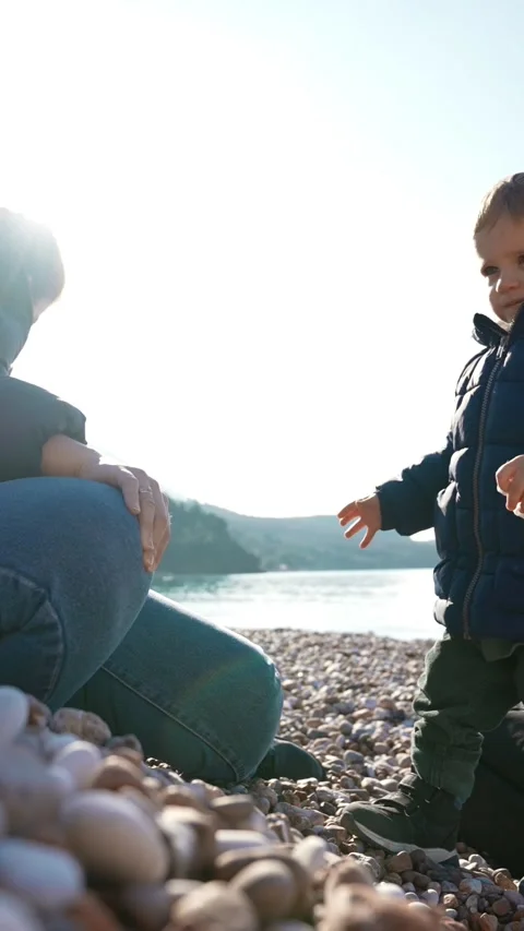 Mom Blows Son Stock Footage ~ Royalty Free Stock Videos | Pond5