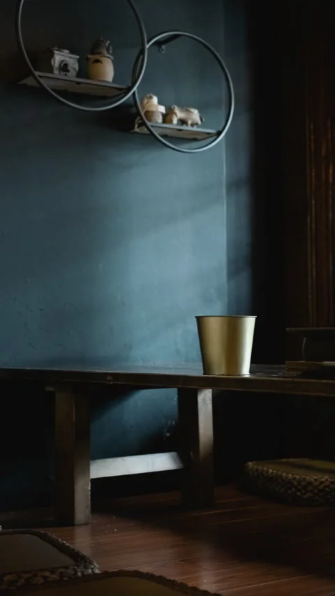 Vertical moody Asian restaurant table with cup and grill plate near window 動画素材 333876362
