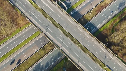 Vertical motorway flyovers parallel lanes ghent vehicle traffic moving through Stock Footage 329077443