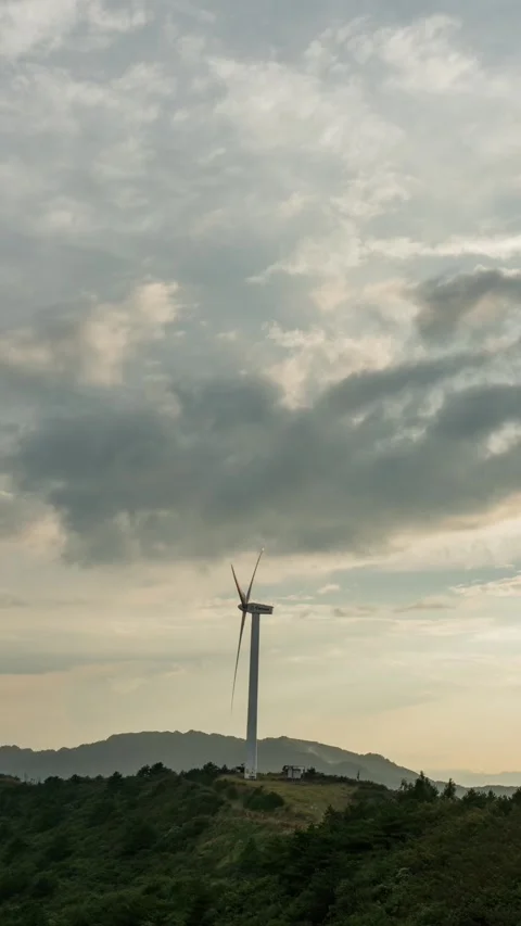 Vertical Mountain Peak Clouds Timelapse with Sunset Glow and Flowing Sky Stock Footage 327599844