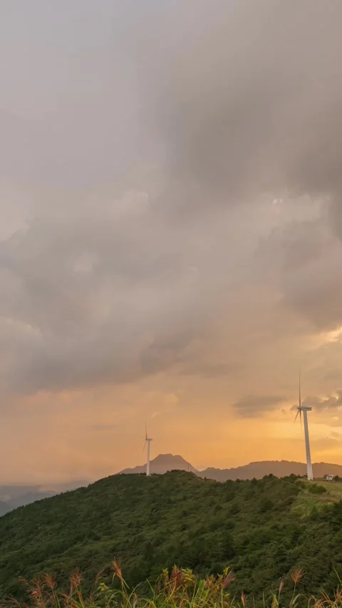 Vertical Mountain Peak Clouds Timelapse with Sunset Glow and Flowing Sky Stock Footage 327601483