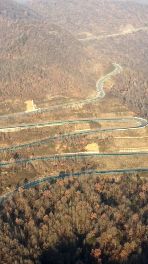 Vertical Mountain Peak Road Aerial View Drone Motion Scenery Stock Footage 327678082