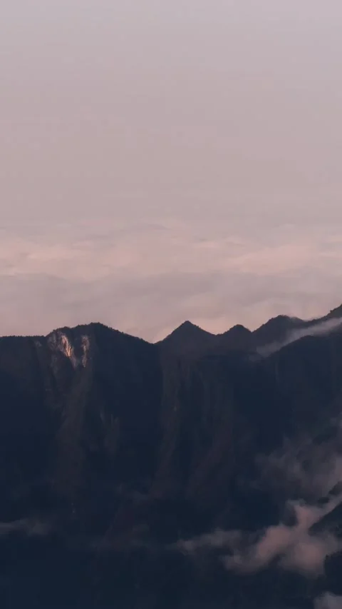 Vertical Mountain Peak Sea of Clouds Flow Nature Motion Timelapse Stock Footage 327671422