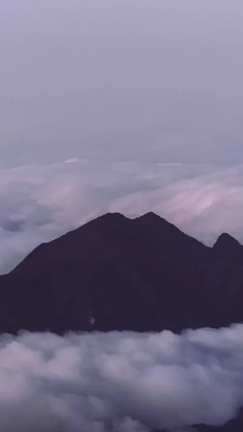 Vertical Mountain Peak Sea of Clouds Flow Nature Motion Timelapse Stock Footage 327671434