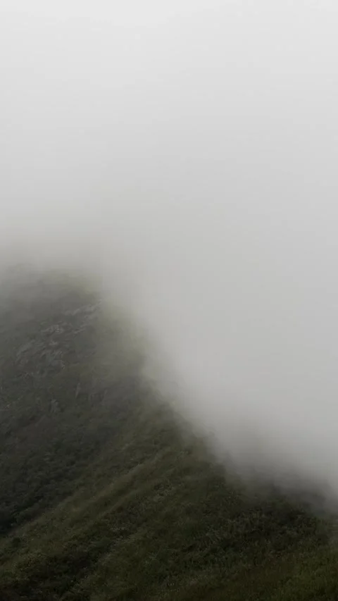 Vertical Mountain Peak Sea of Clouds Flow Nature Motion Timelapse Stock Footage 327673807