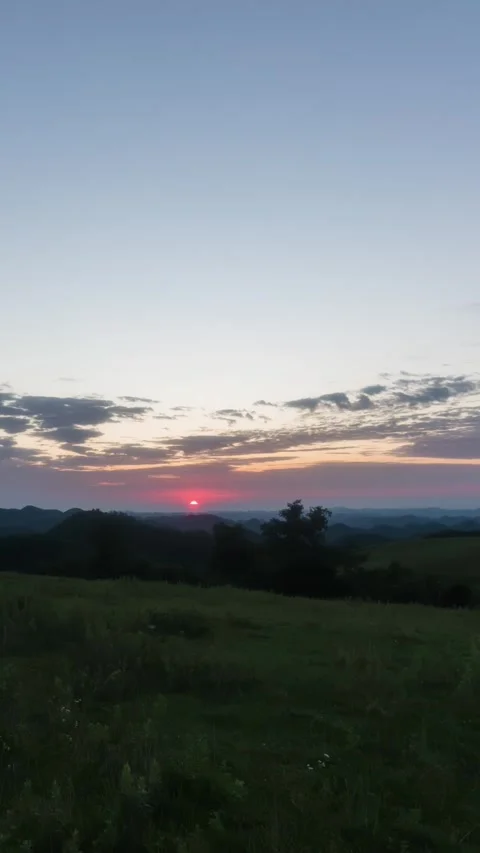Vertical Mountain Peak Sunrise Timelapse with Golden Sun Rays Stock Footage 327669206