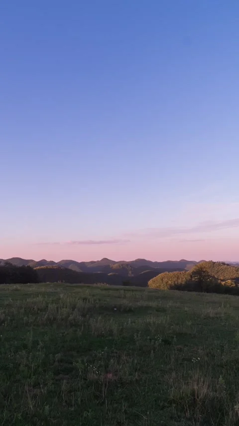 Vertical Mountain Peak Sunset Light and Shadow Motion Timelapse Stock Footage 327669246