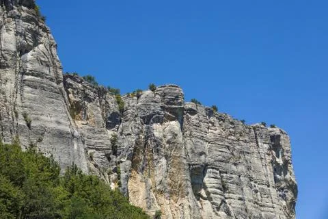 Vertical mountain . Rock climbing the steep cliffs of the mountains . Stock Photos