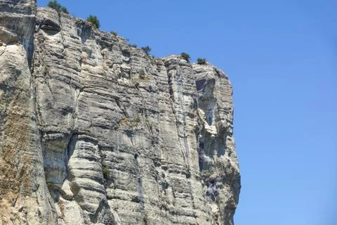 Vertical mountain . Rock climbing the steep cliffs of the mountains . Stock Photos