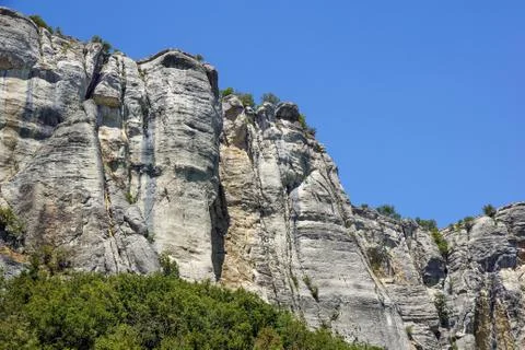 Vertical mountain . Rock climbing the steep cliffs of the mountains . Stock Photos
