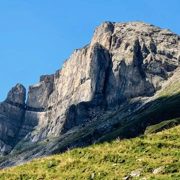 Vertical mountain rock wall peak landscape for outdoor hiking and climbing adven Stock Photos