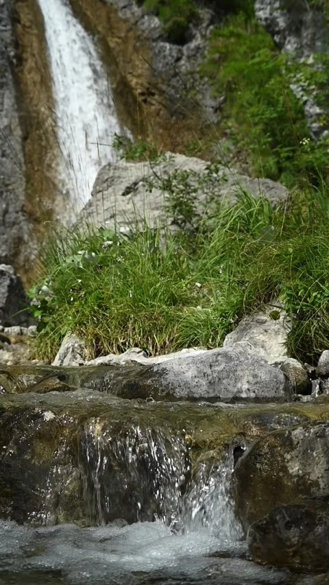 Vertical of a mountain stream and the end of a valley Stock-Footage 260891052