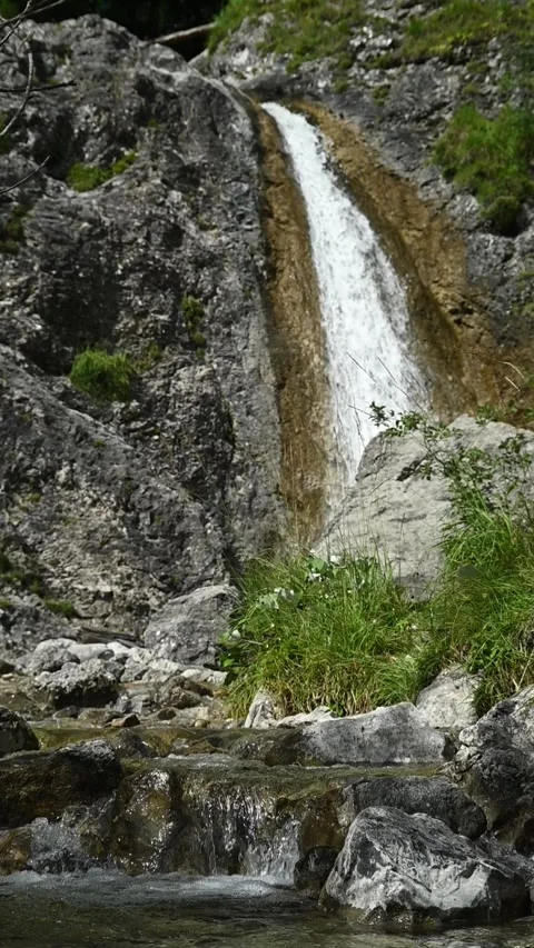 Vertical of a mountain stream and the end of a valley Video stock 260891053