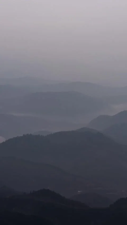 Vertical Mountain Top Mist and Fog Timelapse with Rolling Clouds Nature Vista Stock Footage 327478429