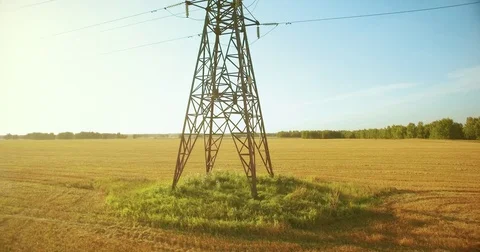 Vertical movement flight near high voltage electricity tower and power lines at Stock Footage