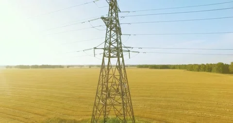 Vertical movement flight near high voltage electricity tower and power lines at Stock Footage 169641463