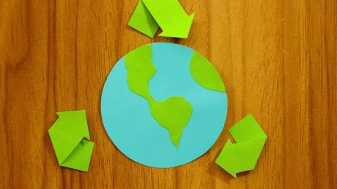 Vertical movement of planet earth made in paper with recycling sign Stock Footage 291951082
