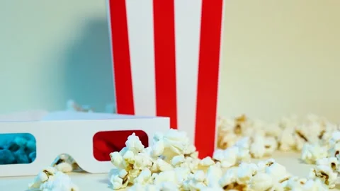 Vertical movement of popcorn and 3d glasses Stock Footage 288183943