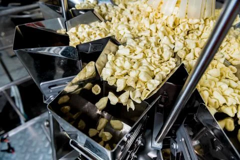 Vertical multi-head weigher packaging machine snacks and chips in a factory Stock Photos
