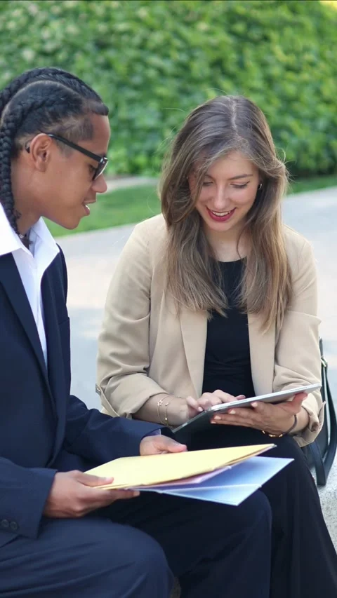 Vertical multicultural Business partners using tablet and analyzing documen.. Stock Footage 317014395