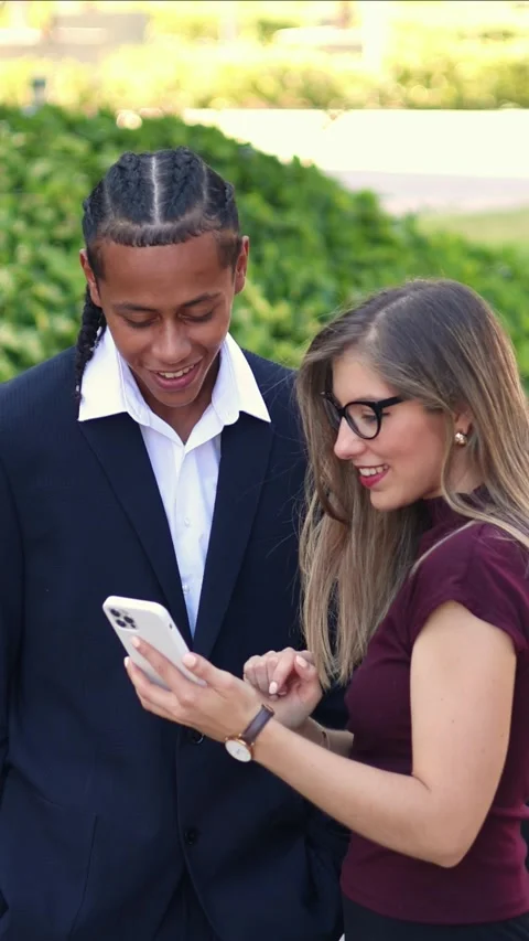 Vertical multicultural Business partners using smartphone in the financial .. Stock Footage 317014401