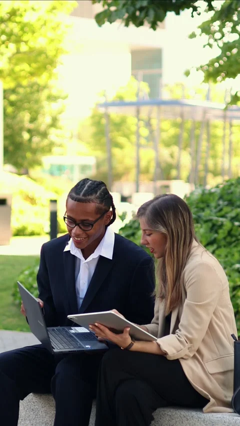 Vertical multiethnic Business partners working together on a laptop and table Stock Footage 317014397