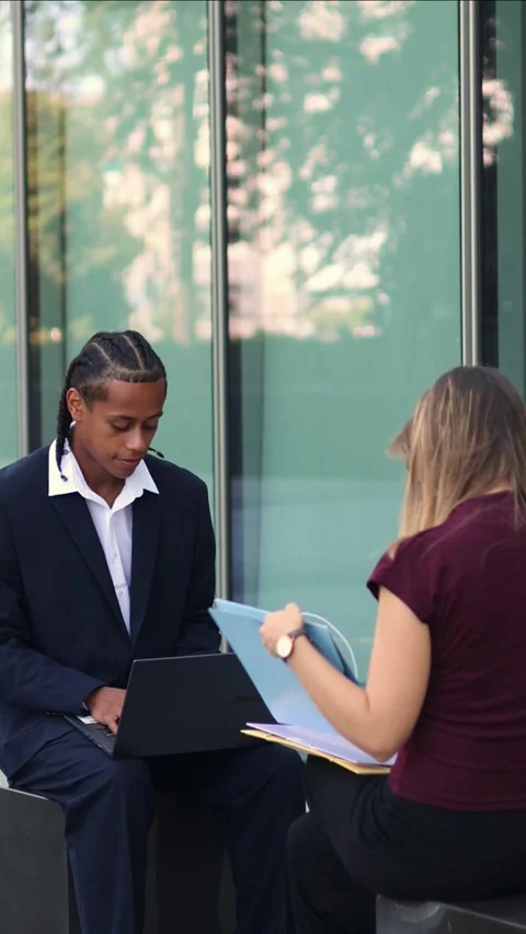 Vertical multiethnic Business partners working together on a laptop in the .. Stock Footage 317014411