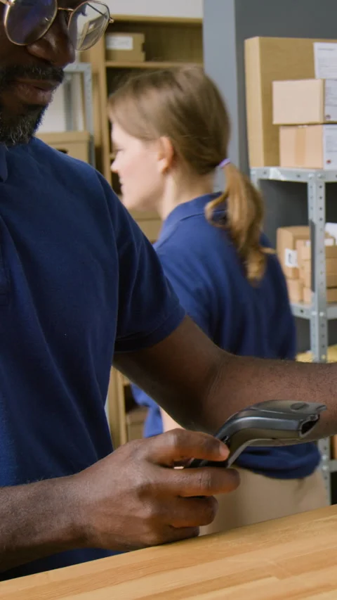 Vertical of Multiethnic Logistics Company Operators Giving Parcel to Client Video stock 321496442