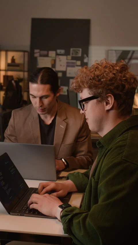 Vertical of Multiethnic Programmers Collaborating on Software Development Stock-Footage 336719098