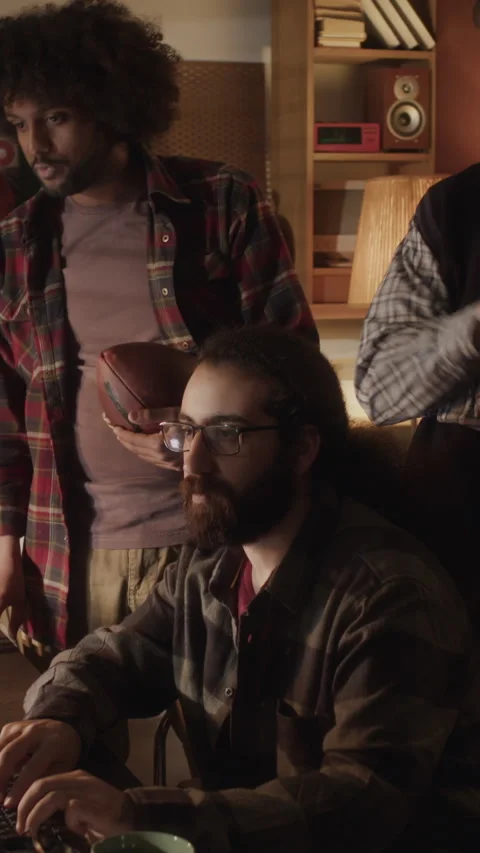 Vertical of Multiethnic Programmers Team Discussing Software on Computer Stock Footage 264245741