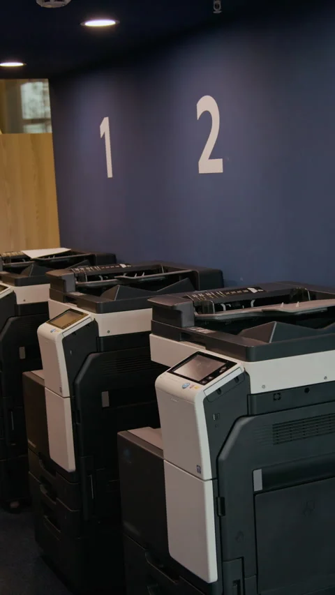 Vertical of Multifunction Printers Ready for Document Processing in Office Stock Footage 333398762