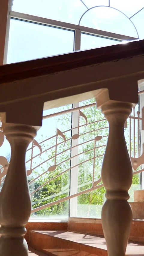 Vertical, Musical notes cascading down a staircase. Staircase adorned with whims Stock Footage 296106772