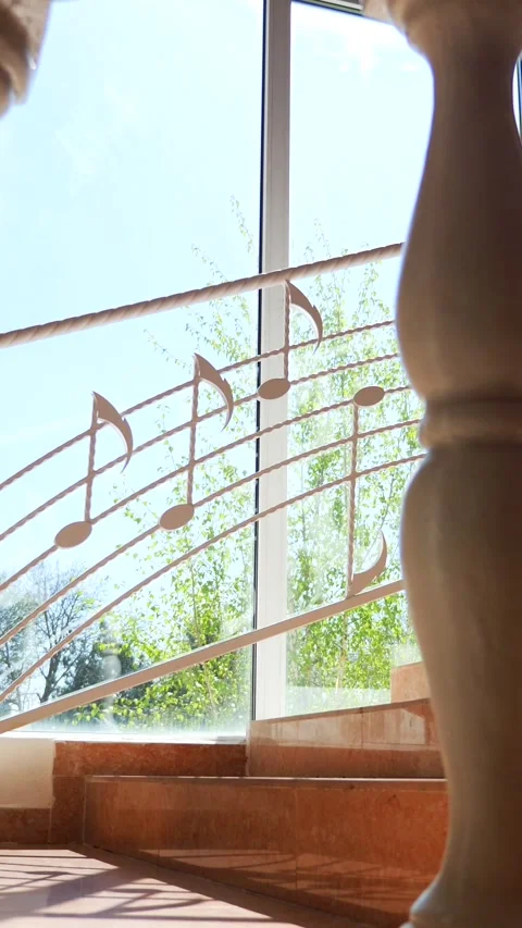 Vertical, Musical notes cascading down a staircase. Staircase adorned with whims Stock Footage 296106789